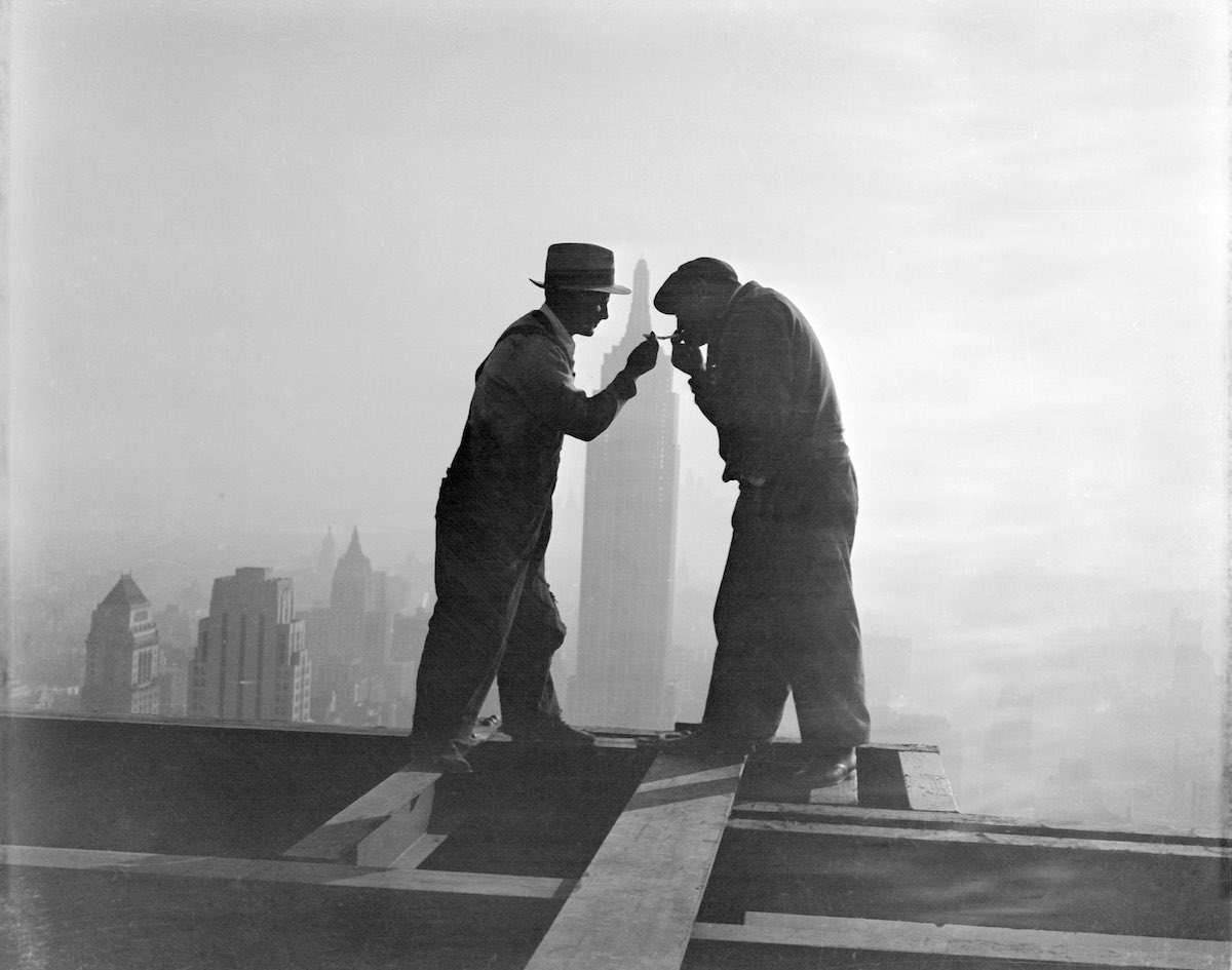 Workers Sharing Cigarettes on Skyscraper Beam
