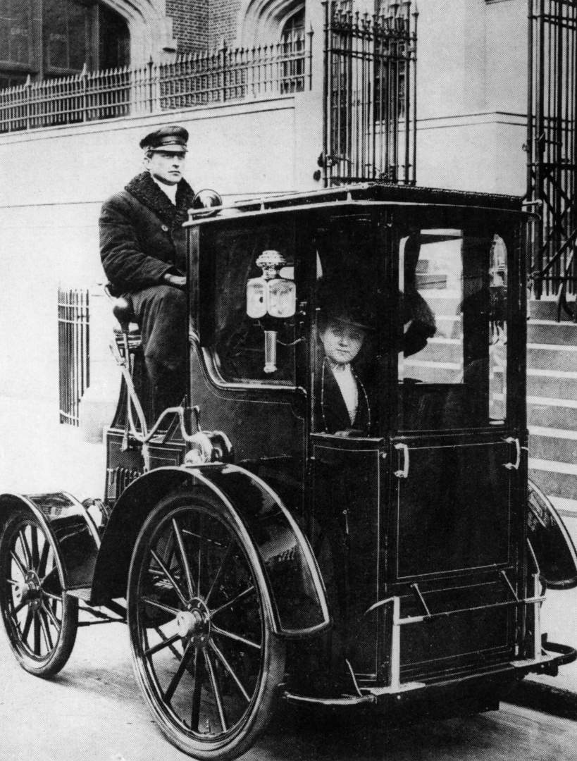 Woman passenger in a 1910 taxi cab, New York, USA, (c1910?).