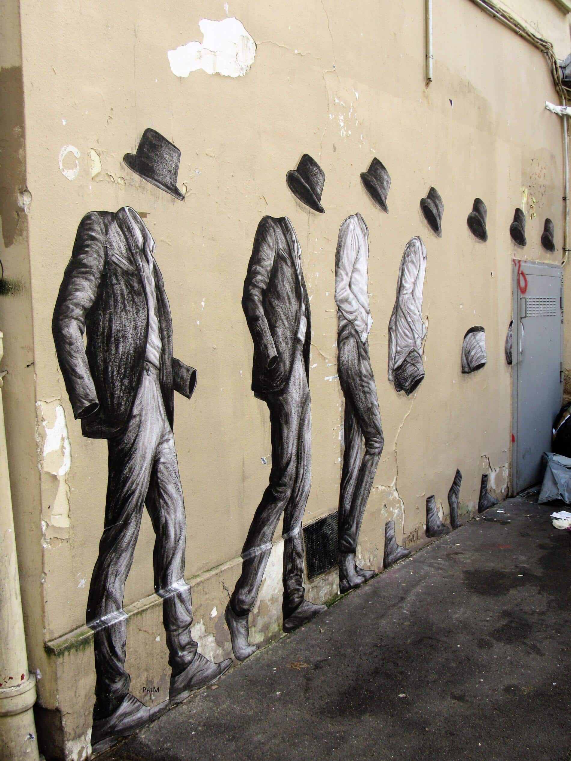street art - levalet - hombres sombrero